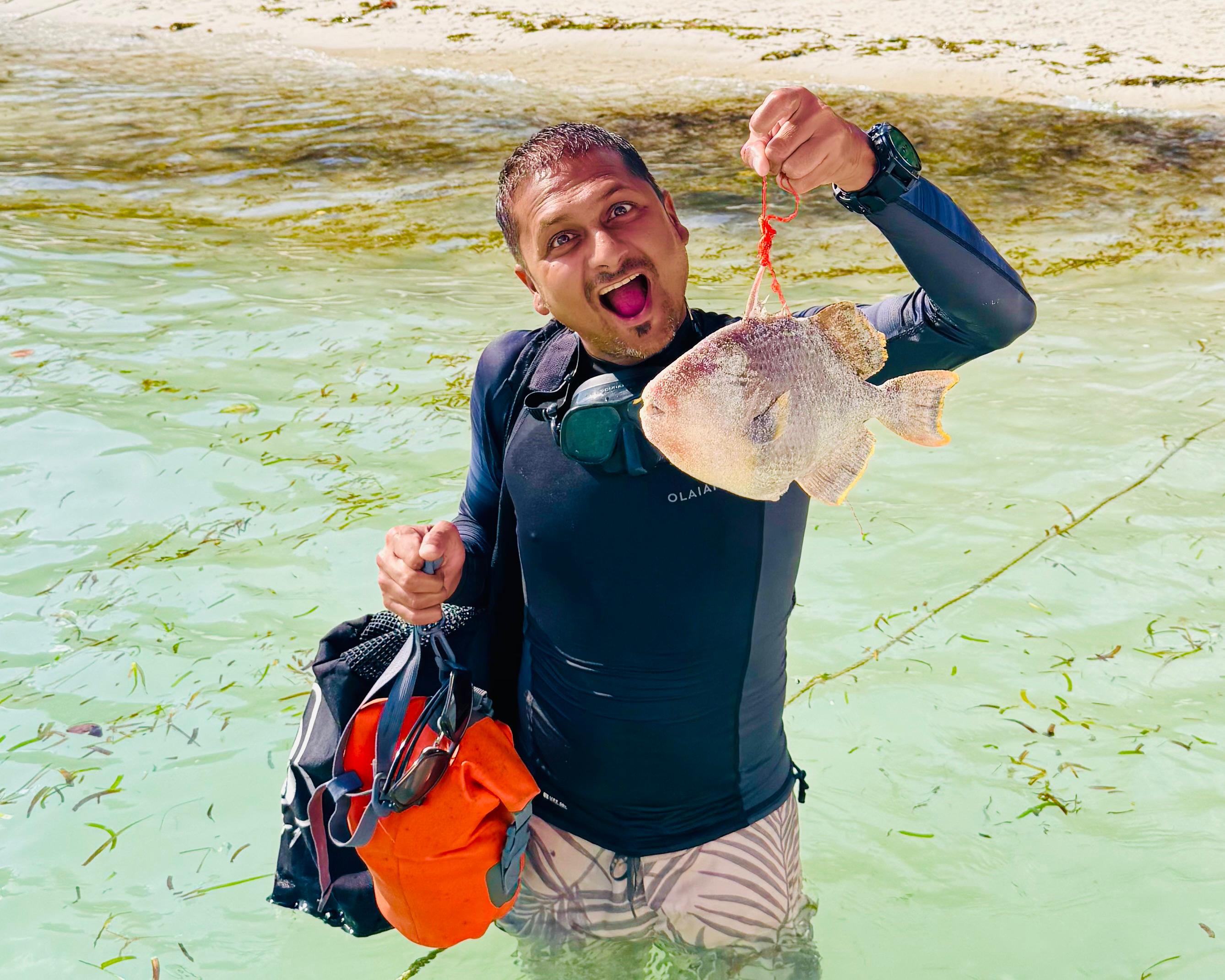Paritosh Agrawal in scuba gear with a student